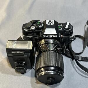Olympus OM-PC 35mm SLR film camera with a Zuiko lens attached #96